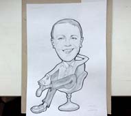 шарж менеджера в кресле в День защитника Отечества в Минске от шаржиста Мишеля, Михаила Шабалина